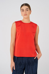 Profile view of model wearing the Oroton Silk Shell Top in Poppy and 92% silk, 8% Spandex for Women