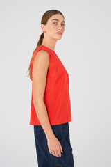Profile view of model wearing the Oroton Silk Shell Top in Poppy and 92% silk, 8% Spandex for Women