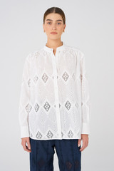Profile view of model wearing the Oroton Diamond Lace Tunic in White and 100% Cotton for Women