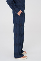 Profile view of model wearing the Oroton Lace Pant in North Sea and 100% Cotton for Women
