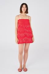 Profile view of model wearing the Oroton Fringed Mini Dress in Poppy and 22.4% polyamide, 28% acrylic, 49.5% polyester for Women