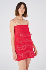 Profile view of model wearing the Oroton Fringed Mini Dress in Poppy and 22.4% polyamide, 28% acrylic, 49.5% polyester for Women