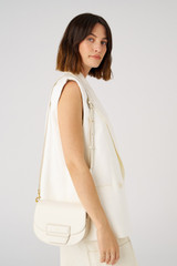Profile view of model wearing the Oroton Dahlia Saddle Bag in Clotted Cream and Smooth leather for Women