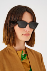 Profile view of model wearing the Oroton Wilder Polarised Sunglasses in Signature Tort and Bio acetate (Biodegradeable) for Women