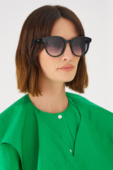 Profile view of model wearing the Oroton Raleigh Polarised Sunglasses in Black and Bio acetate (Biodegradeable) for Women