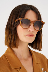 Profile view of model wearing the Oroton Raleigh Sunglasses in Maple Tort and Acetate for Women