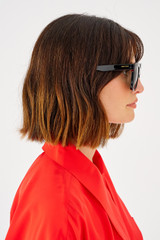 Profile view of model wearing the Oroton Easton Polarised Sunglasses in Black and Bio acetate (Biodegradeable) for Women