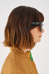 Profile view of model wearing the Oroton Cullen Sunglasses in Treehouse and Acetate for Women