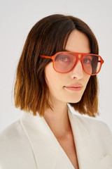 Profile view of model wearing the Oroton Folk Sunglasses in Rust and Acetate for Women