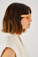 Profile view of model wearing the Oroton Daphne Sunglasses in Clay and Acetate for 