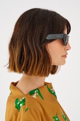 Profile view of model wearing the Oroton Rey Sunglasses in Treehouse and Acetate for 