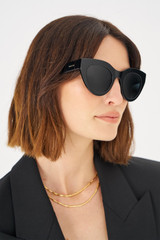 Profile view of model wearing the Oroton Dallas Polarised Sunglasses in Black and Acetate for Women