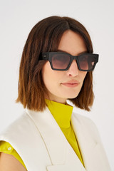 Profile view of model wearing the Oroton Stevie Sunglasses in Black and Bio acetate (Biodegradeable) for Women