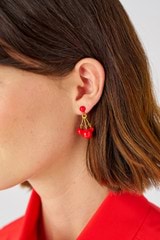 Profile view of model wearing the Oroton Bowman Small Cluster Earrings in Worn Gold/Poppy and Brass base metal for Women