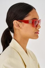 Profile view of model wearing the Oroton Alice Sunglasses in Rust and Acetate for Women