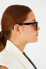 Profile view of model wearing the Oroton Brook Polarised Sunglasses in Signature Tort and Bio acetate (Biodegradeable) for Women