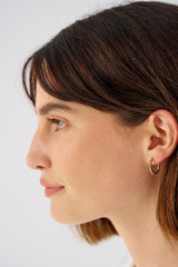Profile view of model wearing the Oroton Fife Hoops in 18K Gold and Recycled 925 Sterling Silver for Women
