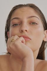 Profile view of model wearing the Oroton Fife Ring in 18K Gold and Sustainably sourced 925 Sterling Silver for Women