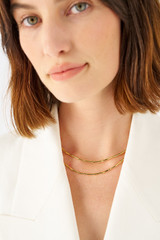 Profile view of model wearing the Oroton Fife Necklace in 18K Gold and Recycled 925 Sterling Silver for Women