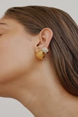 Profile view of model wearing the Oroton Josie Huggies in 18K Gold and Recycled 925 Sterling Silver for Women