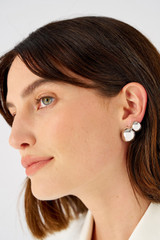 Profile view of model wearing the Oroton Josie Huggies in Silver and Recycled 925 Sterling Silver  for Women