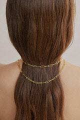 Profile view of model wearing the Oroton Gianna Paper Link Chain Necklace in 18K Gold and Sustainably sourced 925 Sterling Silver for Women