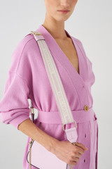 Profile view of model wearing the Oroton Heather Long Webbing Strap in Lilac and Pebble Leather for Women