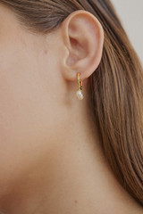Profile view of model wearing the Oroton Melody Multi Pearl Huggies in 18K Gold and Recycled 925 Sterling Silver for Women