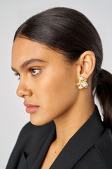 Profile view of model wearing the Oroton Frankie Cluster Stud in Worn Gold/Clear and Brass for Women