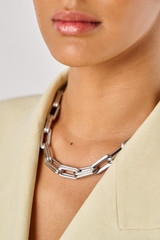 Profile view of model wearing the Oroton Isla Necklace in Silver and Brass for Women