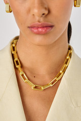 Profile view of model wearing the Oroton Isla Necklace in Worn Gold and Brass for Women