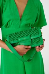 Profile view of model wearing the Oroton Dahlia Collectable Small Day Bag in Jewel Green and Smooth leather. Handwoven leather for Women