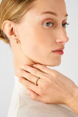 Profile view of model wearing the Oroton Everly Multi Stone Ring in Gold/Clear and Brass for Women