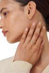 Profile view of model wearing the Oroton Everly Multi Stone Ring in Gold/Clear and 925 Sterling Silver Base With 18CT Gold Plating for Women