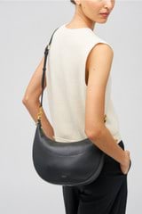 Profile view of model wearing the Oroton Florence Medium Hobo in Black and Smooth leather for Women