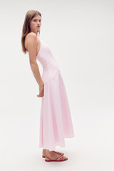 Profile view of model wearing the Oroton Halter Sundress in Ballet Pink and 100% linen for Women