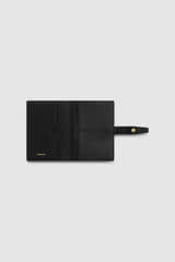 Internal product shot of the Oroton Fife Passport Sleeve in Black and Pebble leather for Women