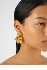 Profile view of model wearing the Oroton Peony Drop Earrings in Worn Gold and Brass for Women