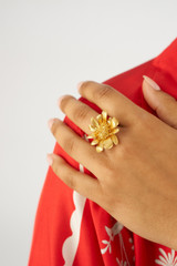 Profile view of model wearing the Oroton Peony Ring in Worn Gold and Brass for Women