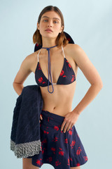 Profile view of model wearing the Oroton Dutch Tulip Bikini Top in North Sea and 78% polyamide, 22% elastane for Women