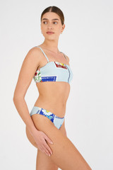 Profile view of model wearing the Oroton Picnic Print Bandeau Bikini Top in Pale Blue and 78% polyamide, 22% elastane for Women