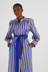 Profile view of model wearing the Oroton Positano Stripe Shirt Dress in Swedish Blue and 100% Cotton for Women