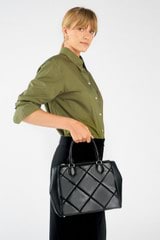 Profile view of model wearing the Oroton Inez Quilted Medium City Tote in Black and Smooth Leather for Women