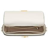 Internal product shot of the Oroton Yvonne Small Saddle Bag in Cream and Pebble Leather for Women