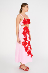 Profile view of model wearing the Oroton Contrast 3D Flower A-Line Skirt in Rose/Poppy and 100% linen for Women