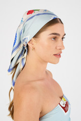 Profile view of model wearing the Oroton Picnic Scarf in Pale Blue and 100% silk for Women