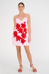 Profile view of model wearing the Oroton Contrast 3D Flower Mini Dress in Rose/Poppy and 100% linen for Women