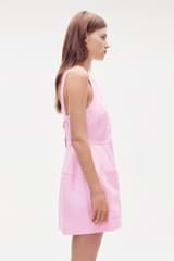 Profile view of model wearing the Oroton Detailed Shift Dress in Rose and 58% viscose, 42% linen for Women