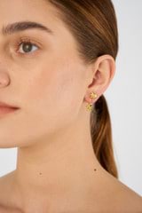 Profile view of model wearing the Oroton Daisy Studs in 18K Gold and Sustainably sourced 925 Sterling Silver for Women