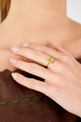 Profile view of model wearing the Oroton Daisy Ring in 18K Gold and Sustainably sourced 925 Sterling Silver for Women